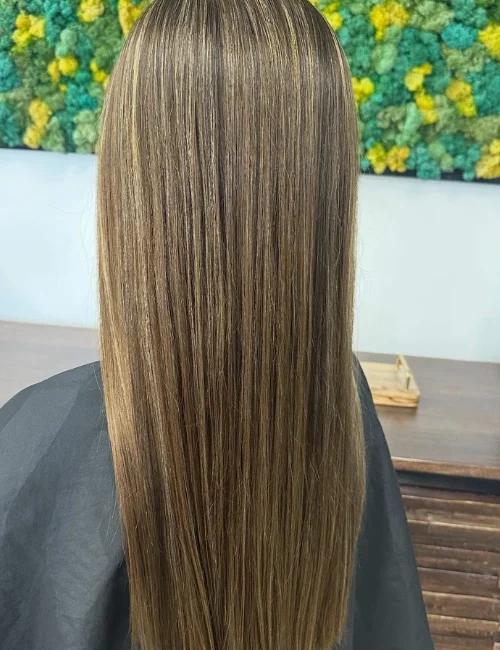 Back of a woman's head, showcasing her new hair cut and brown color at EDEN Spa Suites
